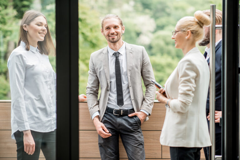 Business people on the office balcony during a break